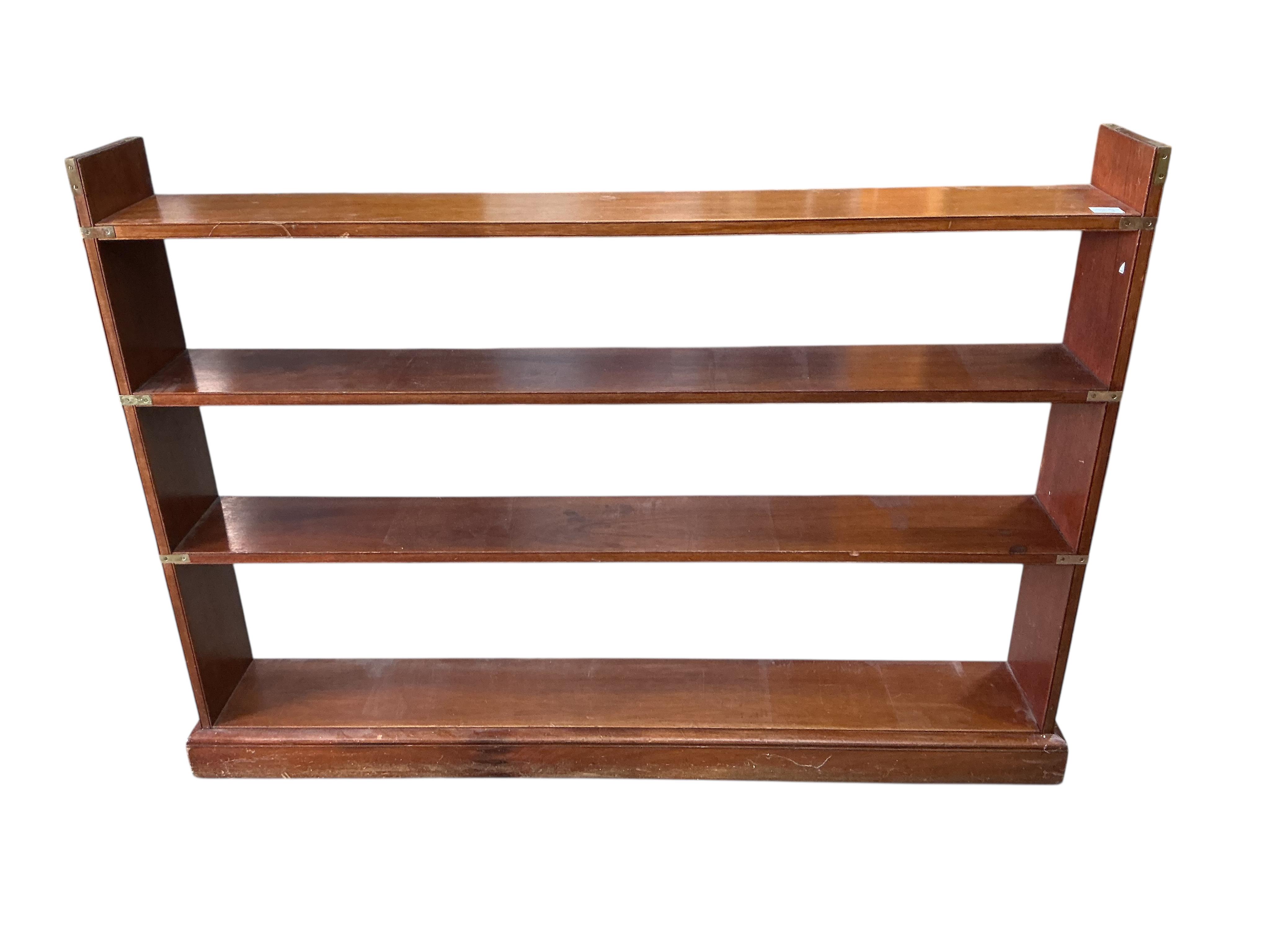 A military style brass mounted mahogany open bookcase, width 150cm, depth 23cm, height 108cm